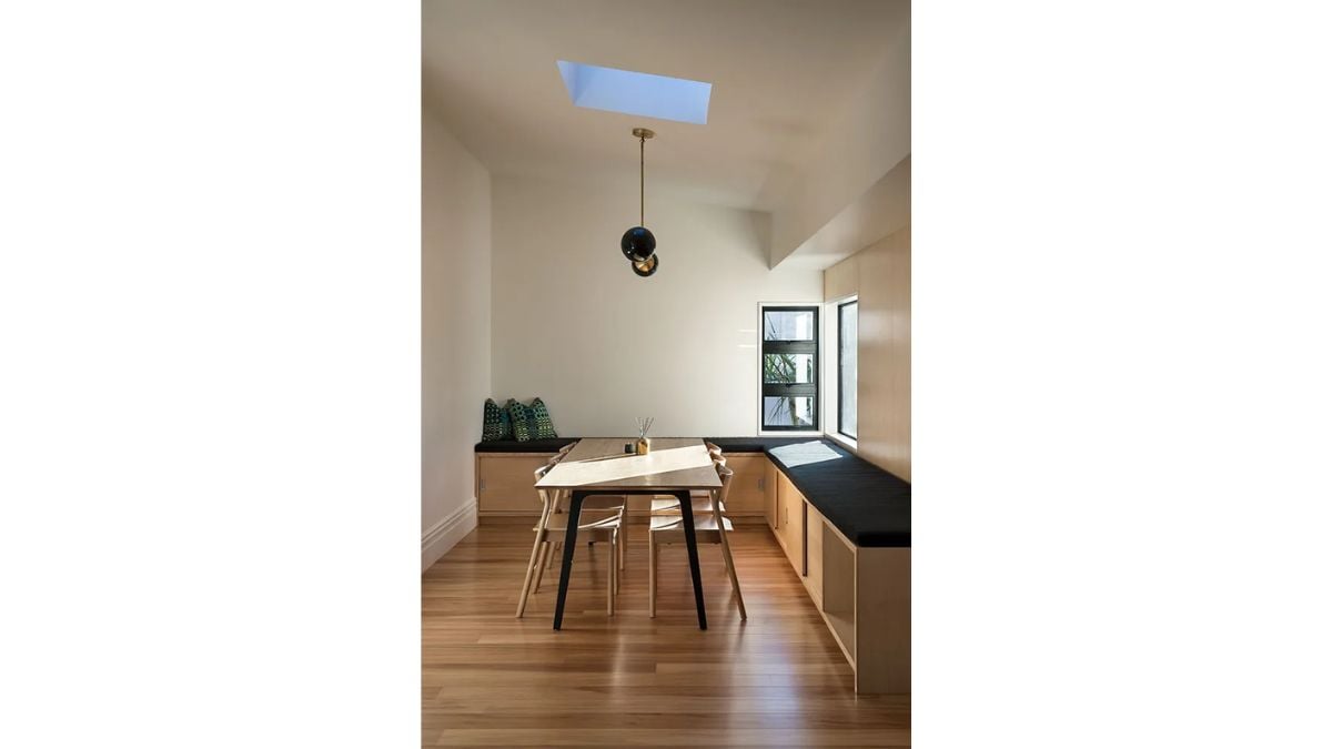The wooden structures and furnishings in the dining room have a rustic feel.