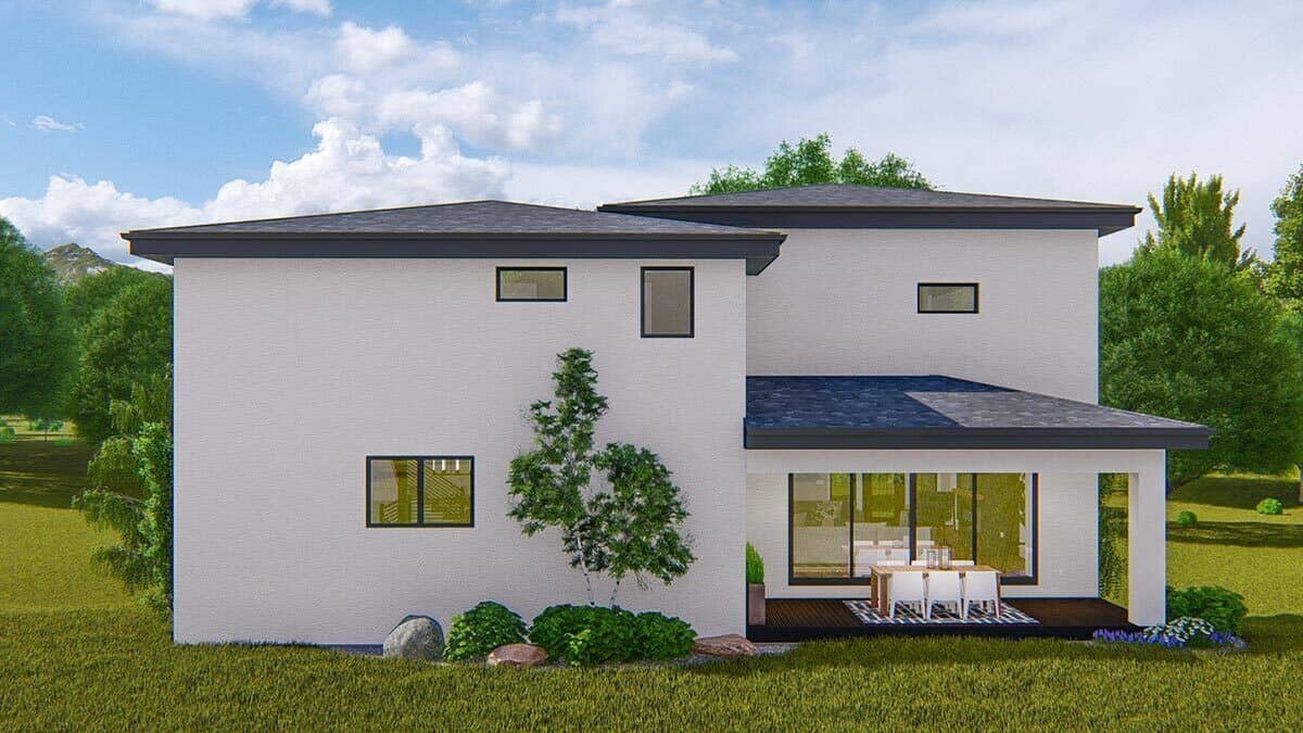 Rear rendering with a covered patio furnished with an outdoor dining set.