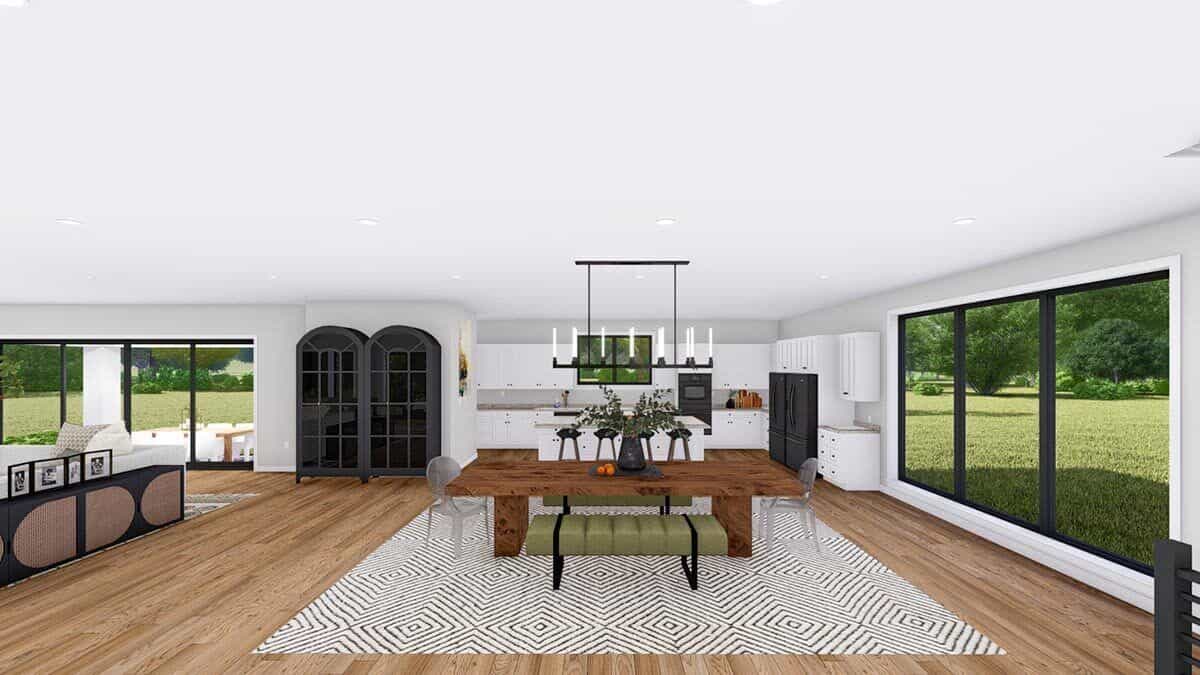 Dining area with a wooden dining set sitting on a patterned area rug.