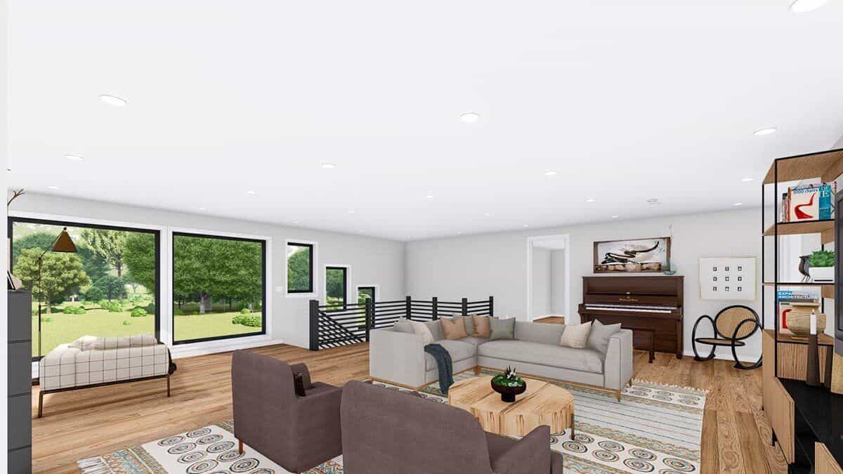The living room is filled with comfy seats, wooden tables, and an upright piano.