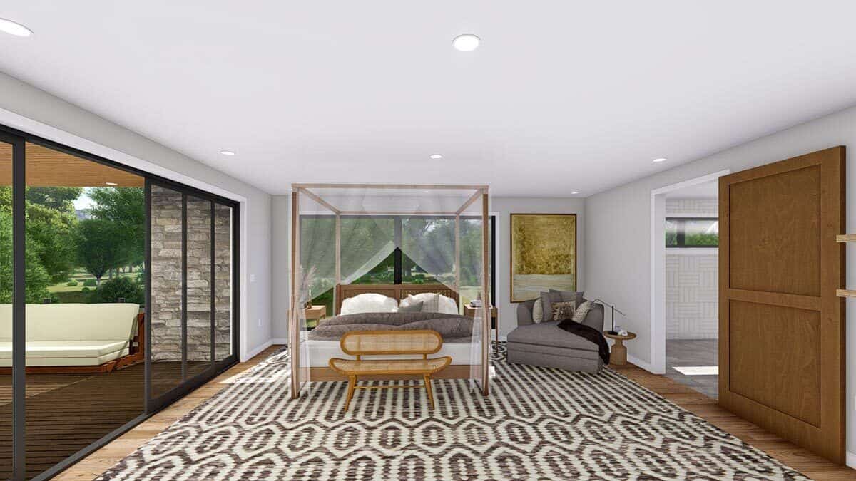 The primary bedroom features a canopy bed and a large private deck accessible via sliding glass doors.
