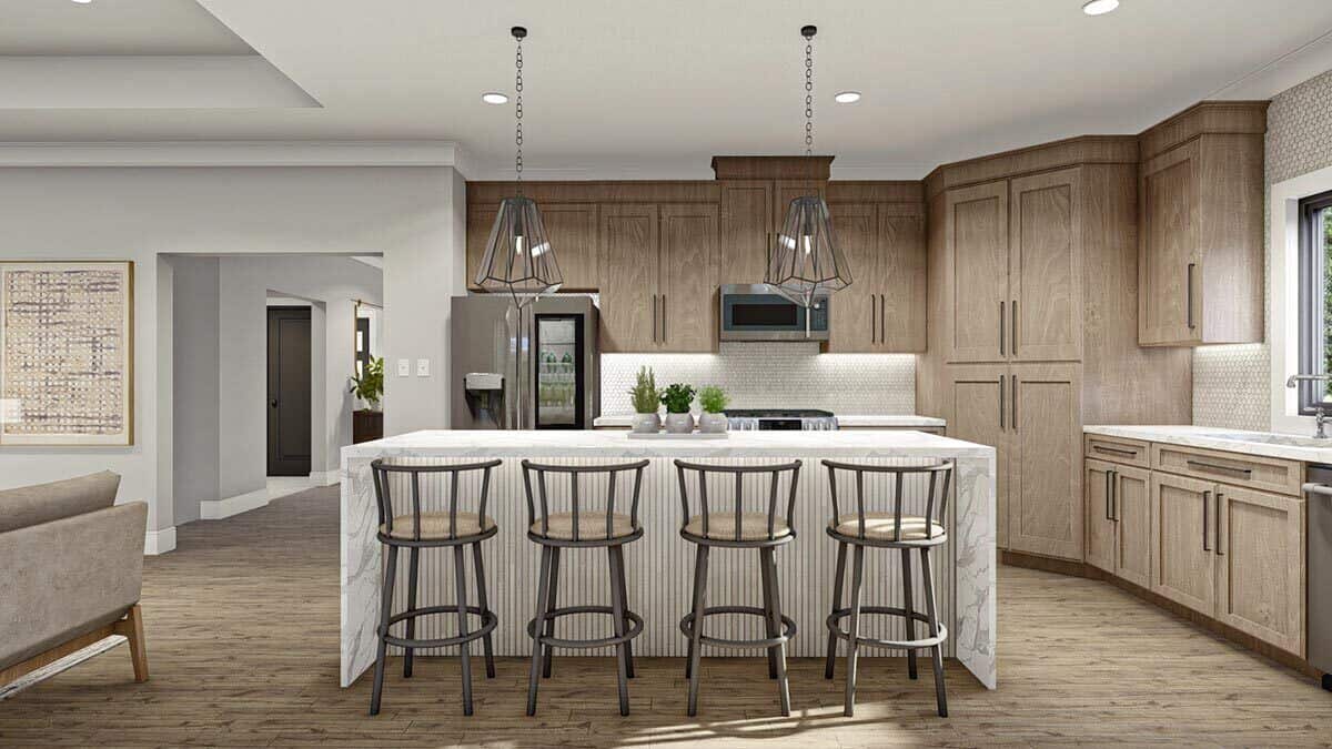 The kitchen offers natural wood cabinets, premium appliances, and a waterfall island paired with round bar stools.