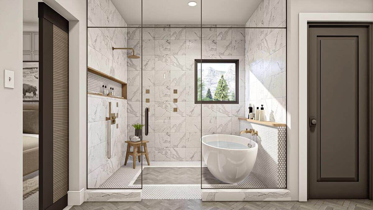 The primary bathroom has a wet room equipped with brass fixtures, a shower area, and a freestanding tub.