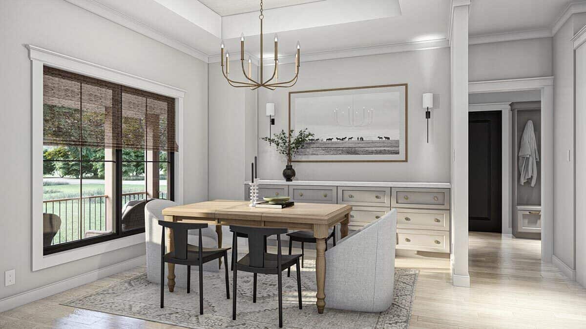 Formal dining room with a contemporary dining set, a candle chandelier, and a built-in buffet table adorned with framed artwork.