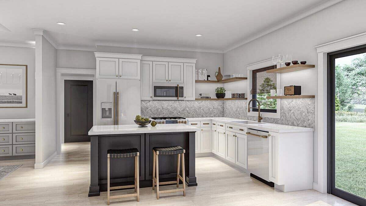 Kitchen with an L-shaped layout, a breakfast island, and outdoor access.