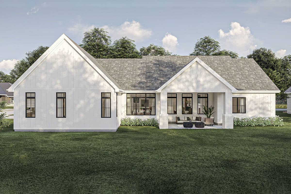 Rear rendering with lots of windows and a gabled porch supported by stone base columns.