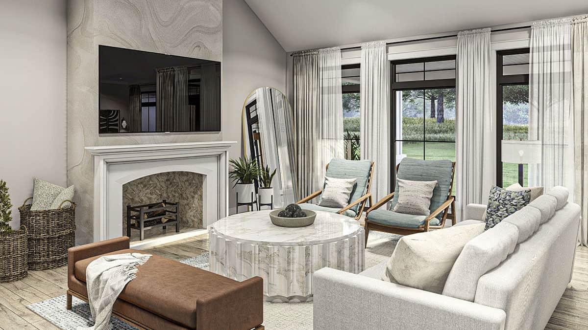 The living room features modern furnishings and a large TV mounted above the fireplace.