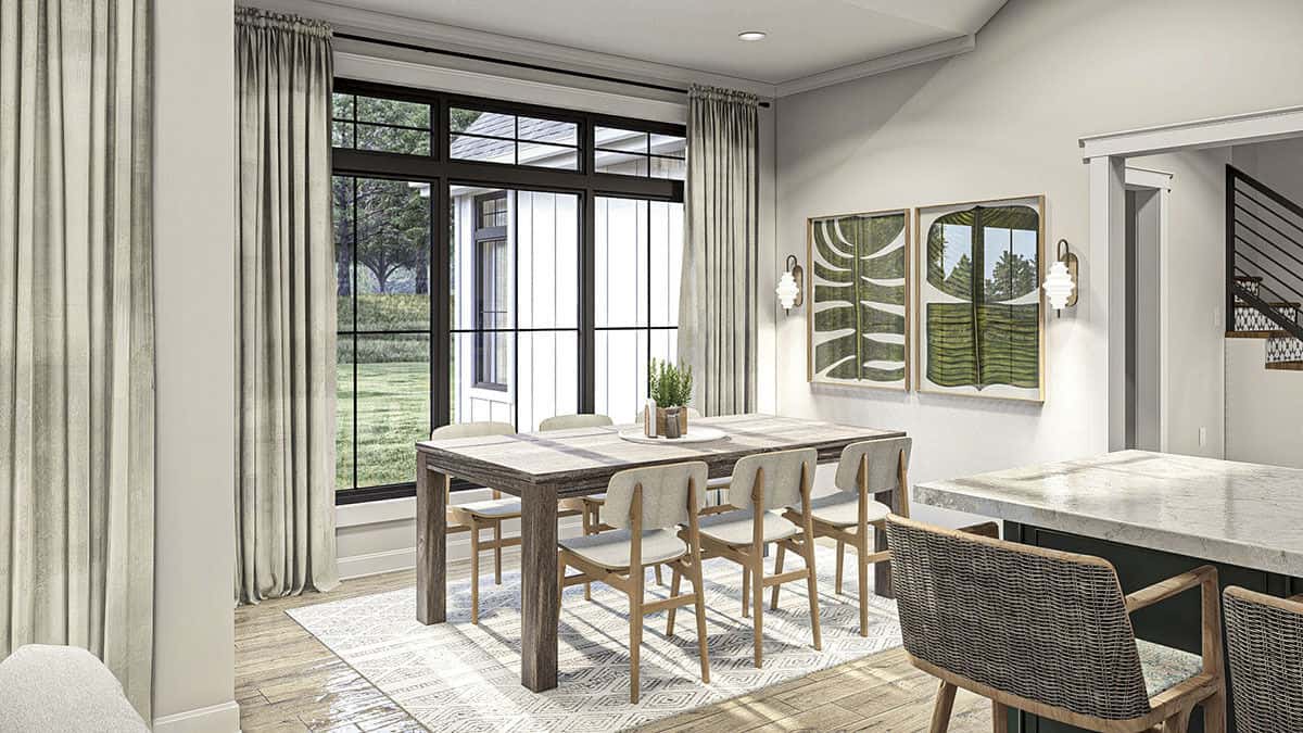 The dinette offers a rustic dining set and amazing backyard views.