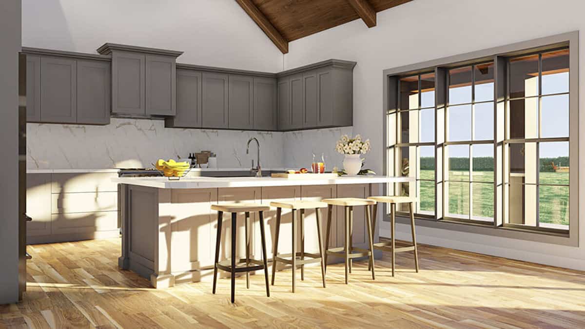 Large windows provide the kitchen with expansive backyard views.