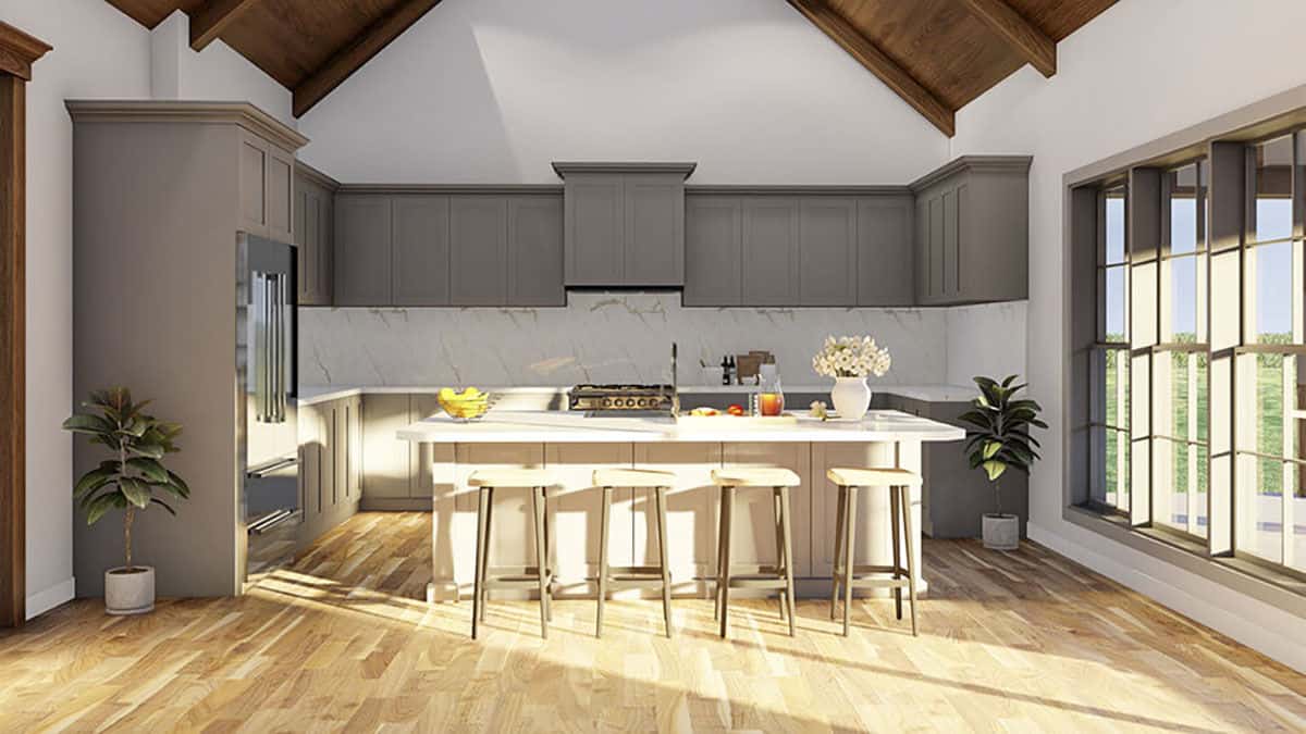 The kitchen has gray cabinetry, marble countertops, and a breakfast island paired with wooden bar stools.