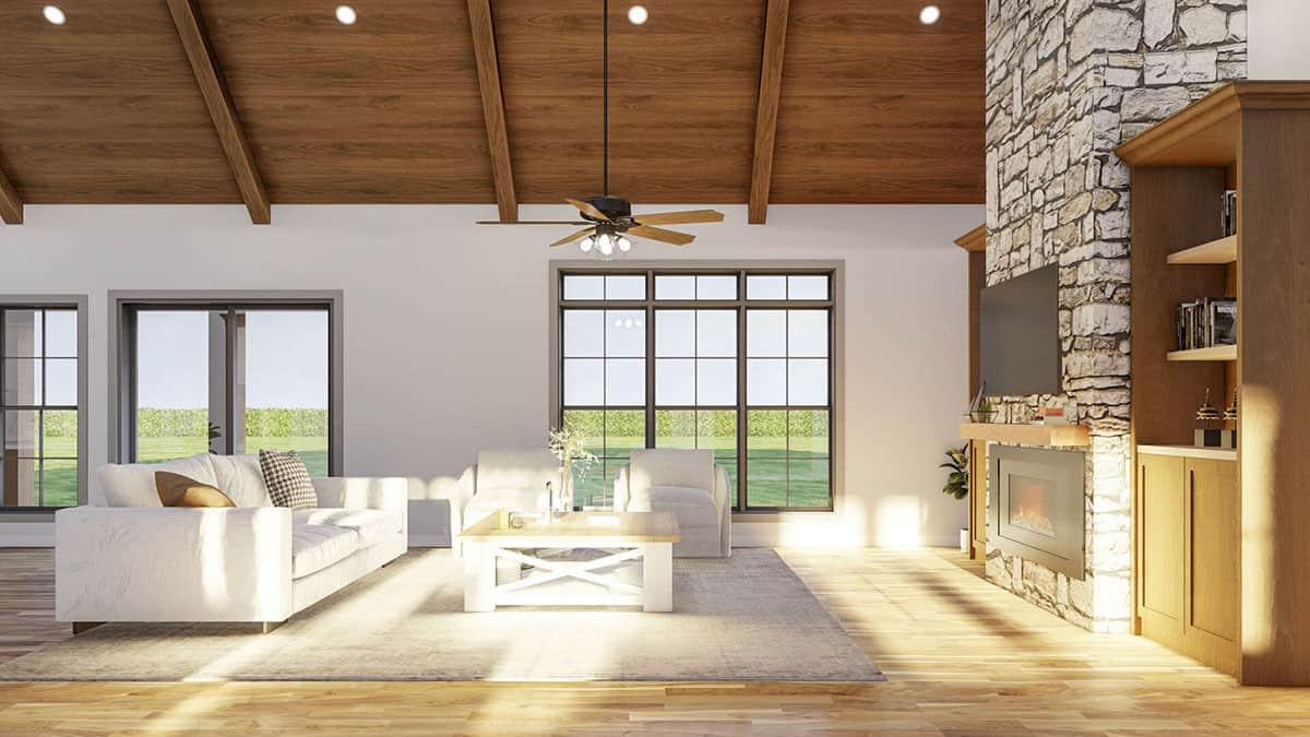 The living room includes a gray sofa, matching armchairs, and a wooden coffee table.