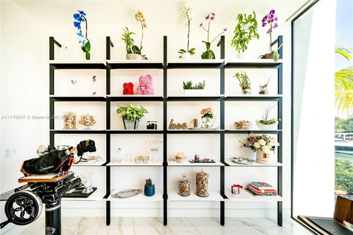 Beautiful indoor plants and orchids are beside the dining area giving color to the place.