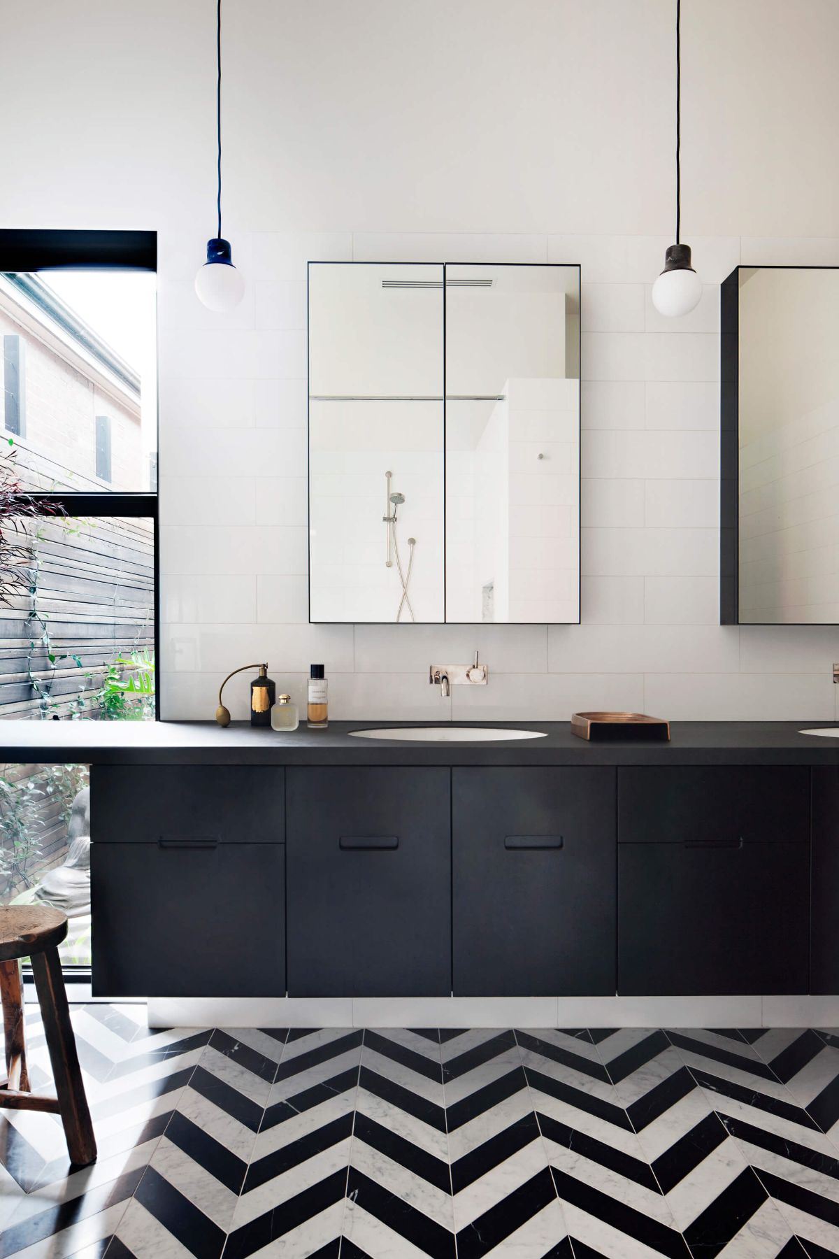 The bathroom features a vanity sink and a shower area.