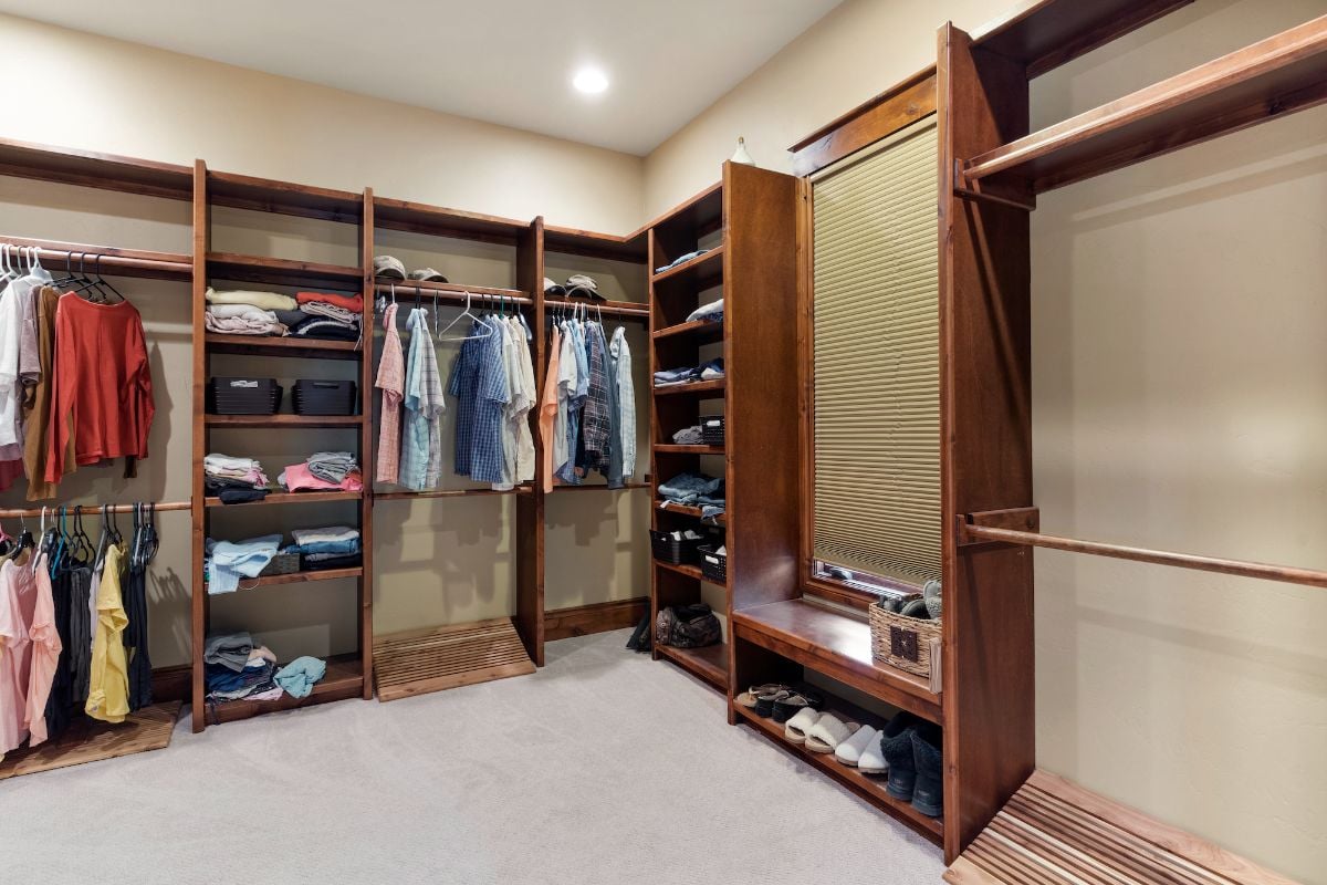 The bedroom features a dresser made of solid wood.