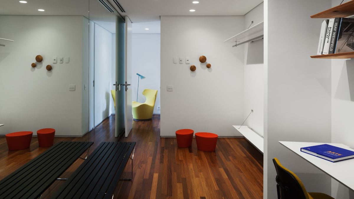 The walls of the room are white, and the flooring is hardwood.