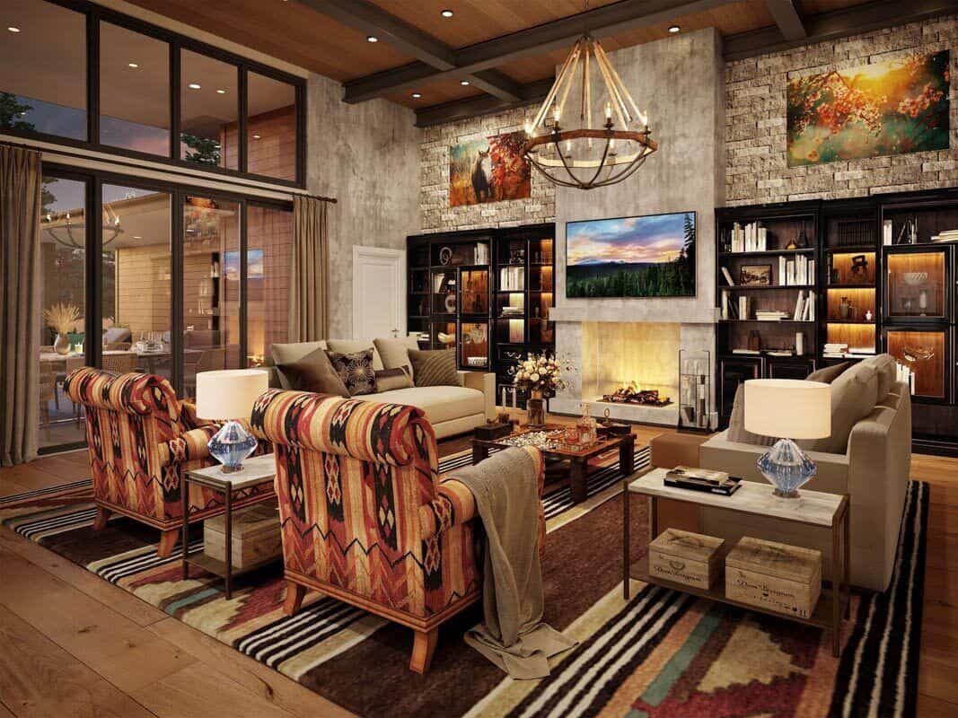 The great room has gray sofas, patterned armchairs, and a fireplace topped with a TV.