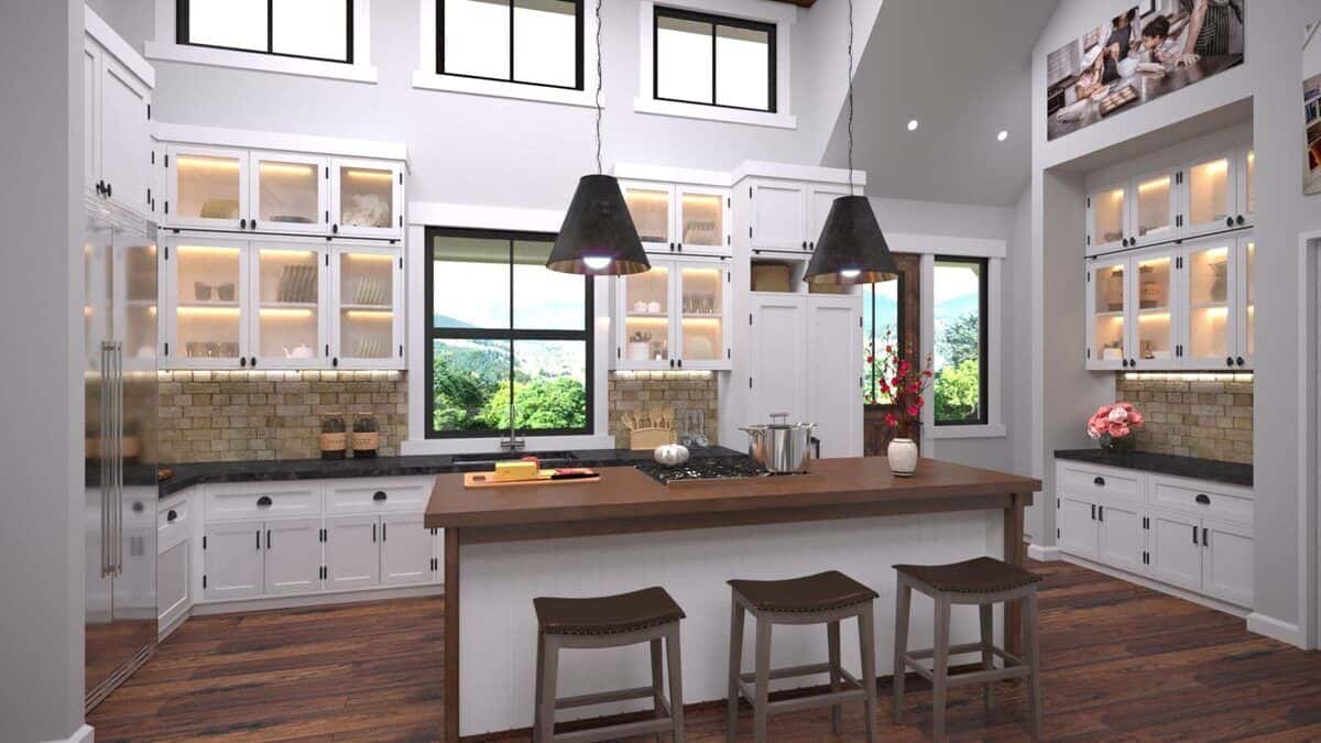 Kitchen with white and glass-front cabinetry, clerestory windows, and a cooktop island with three bar seating.