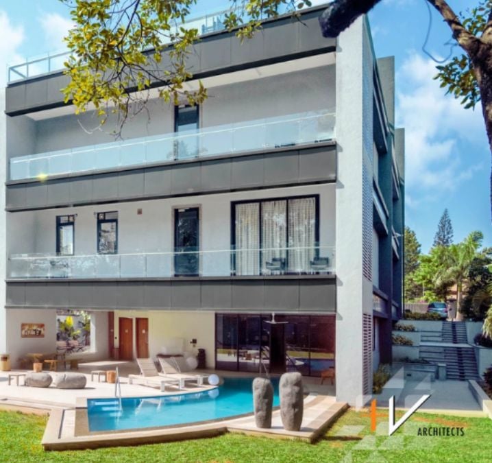 "This is a four-story building featuring an in-ground pool on the first level, along with spacious outdoor areas.