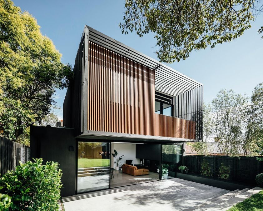 A photographic representation of the exterior design of the Black House's frontal facade, captured from a different perspective in closer proximity.