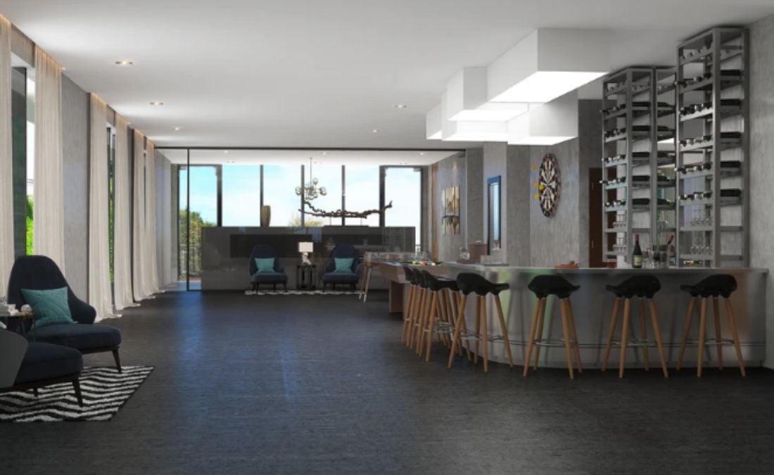 This is an interior shot of a spacious bar section with an L-shaped countertop table.