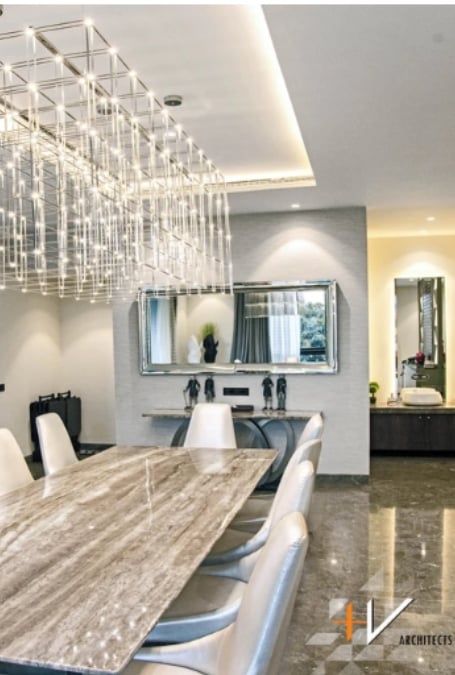 Quasar Suspension Lamp that is located in a modern dining area