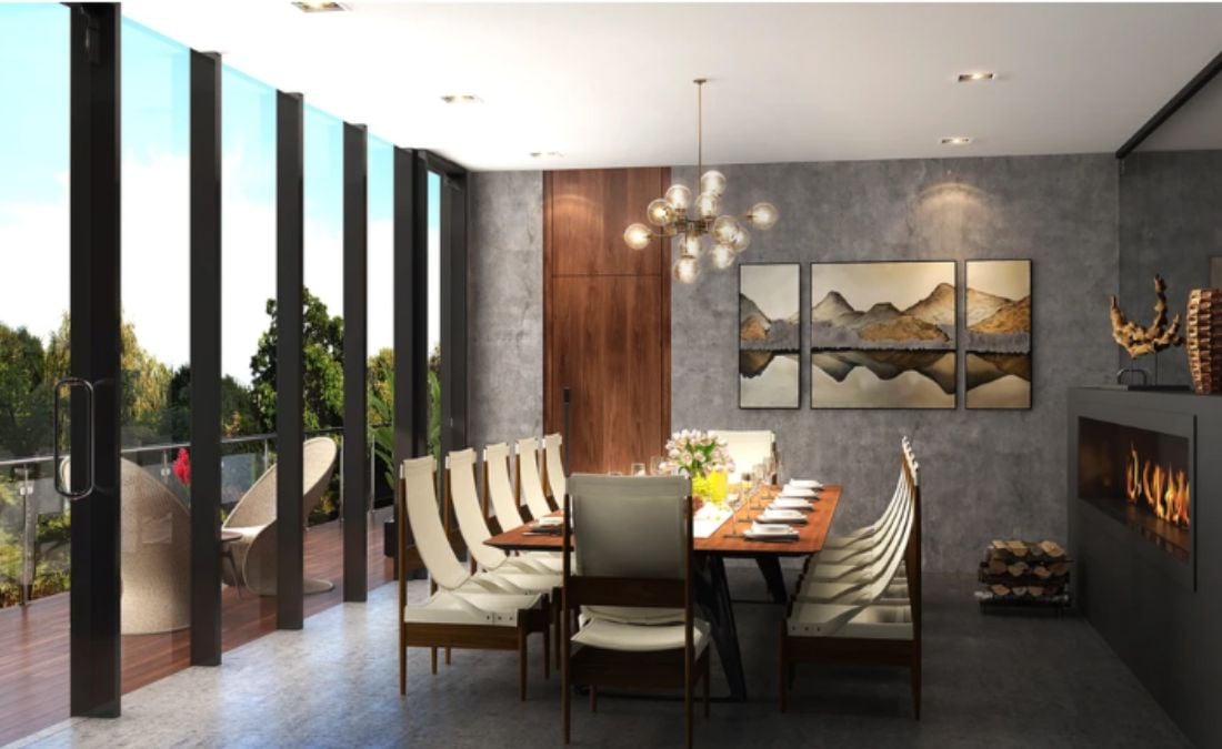 An interior shot of a modern dining room filled with prestigious furniture and a wall adorned with a collage of canvas art.
