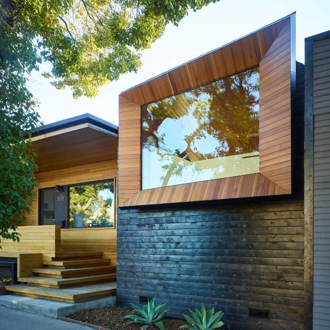 This photograph captures the exterior of the house, showcasing its contemporary architectural design.