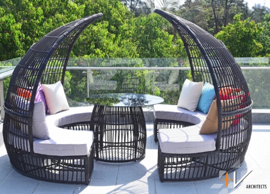 Round sun lounger on a deck.
