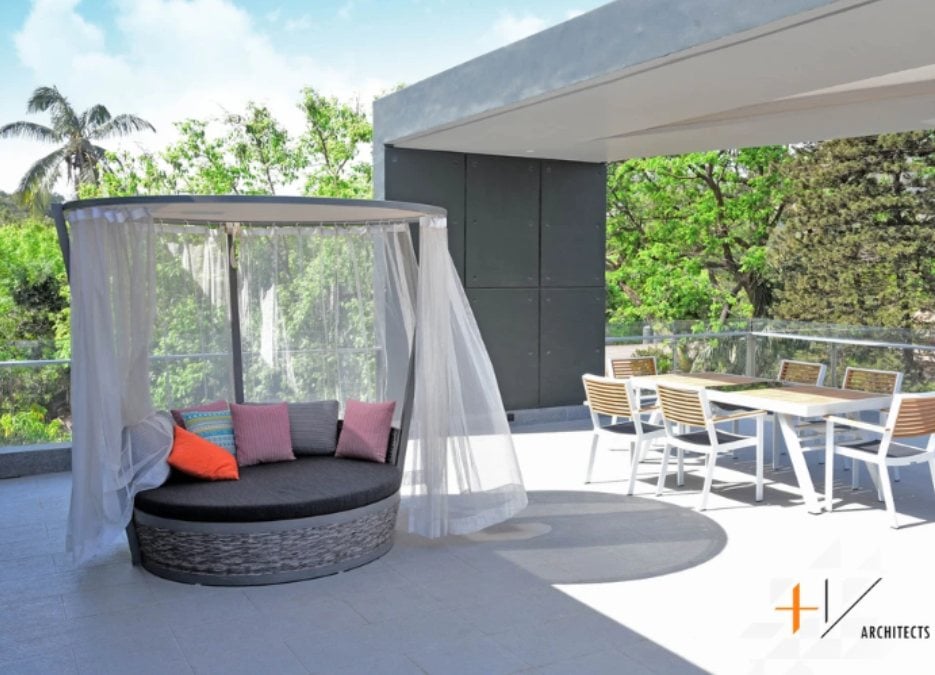 An exterior shot of a lovely outdoor space that features a charming pavilion.