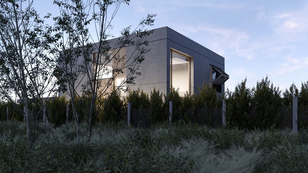 The exterior shot of the house, taken during dusk, showcases the property surrounded by lush green foliage.