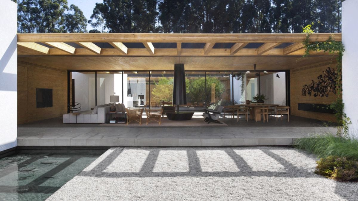The leisure and living area has wide glass walls where the landscape is visible.