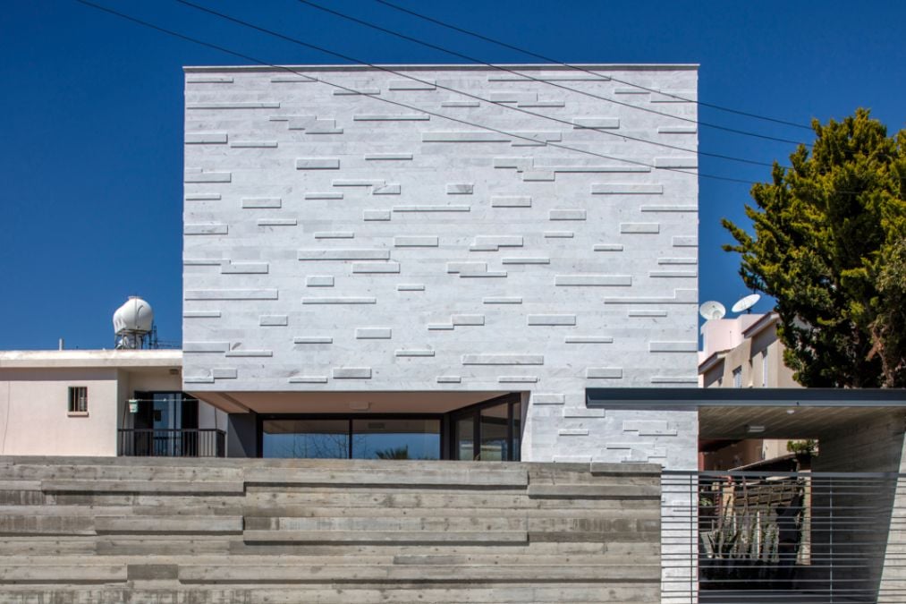 This close-up shot focuses on the unique layout of the marble-clad mass on the upper level.