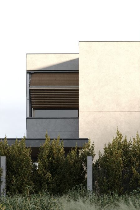 The exterior shot highlights the foldable shutters on the windows and the green plants situated in front of the building.