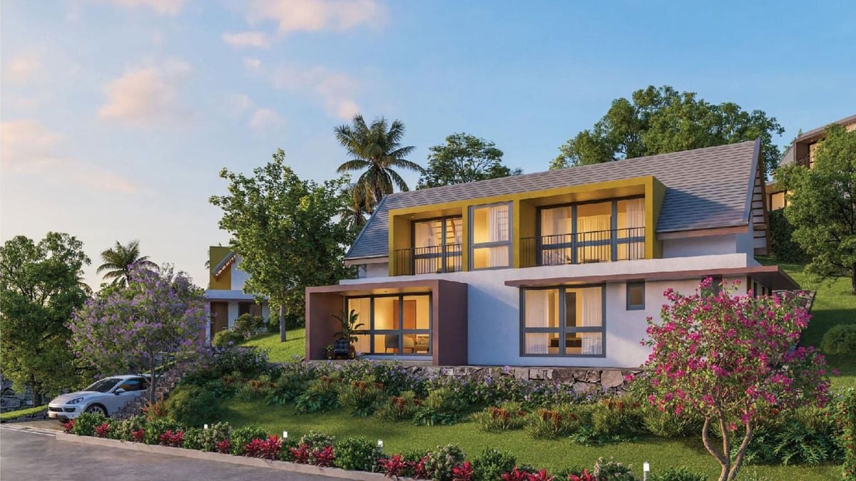The exterior of this house showcases an elegant architectural design and a spacious garden area.