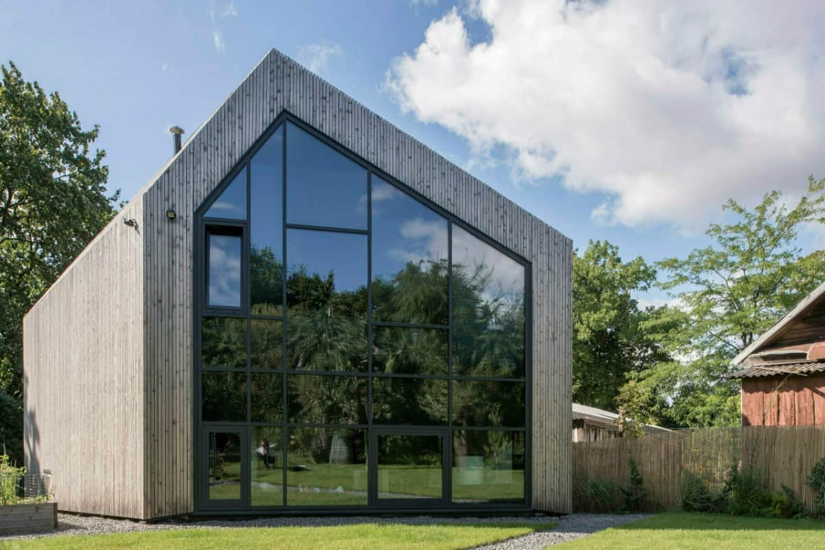 During the day, tinted glass windows mirror the surroundings as it provides privacy.