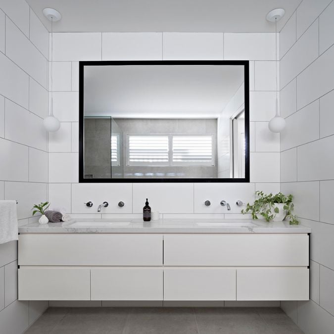 This section showcases a white-themed layout featuring a sink and a wall-mounted mirror.