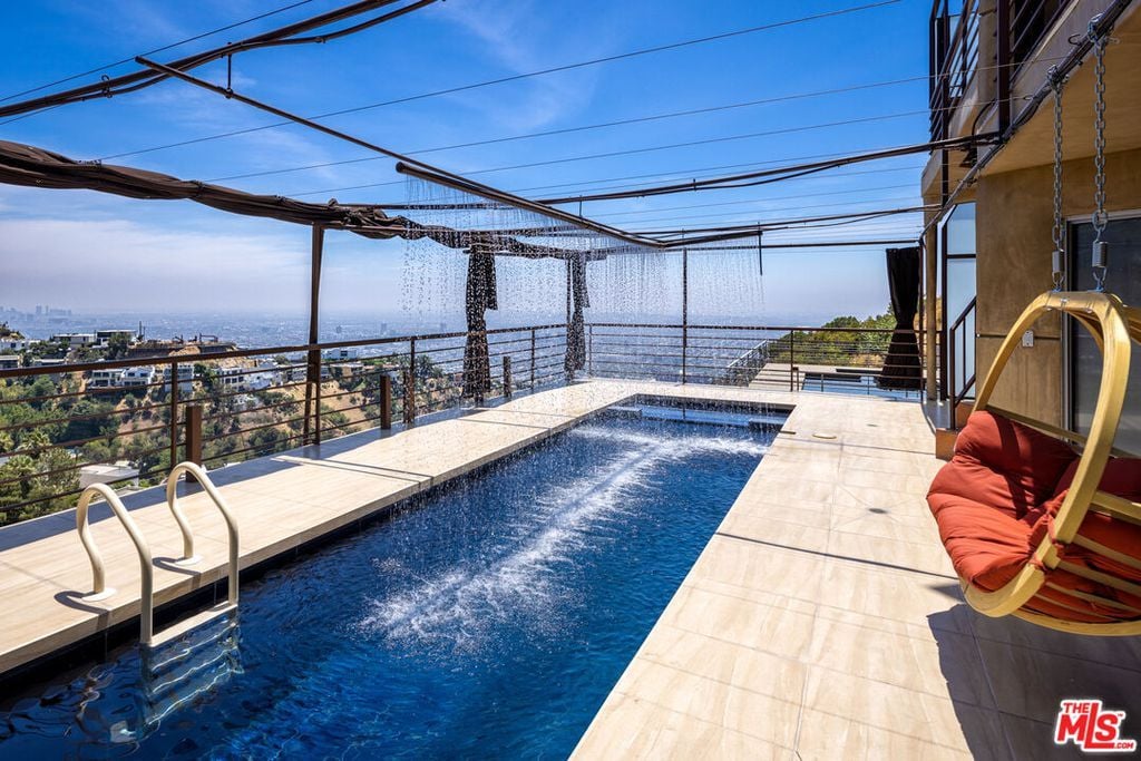 The luxurious outdoor pool was the perfect spot to cool off on a hot day, with breathtaking views of the city stretching out as far as the eye could see.