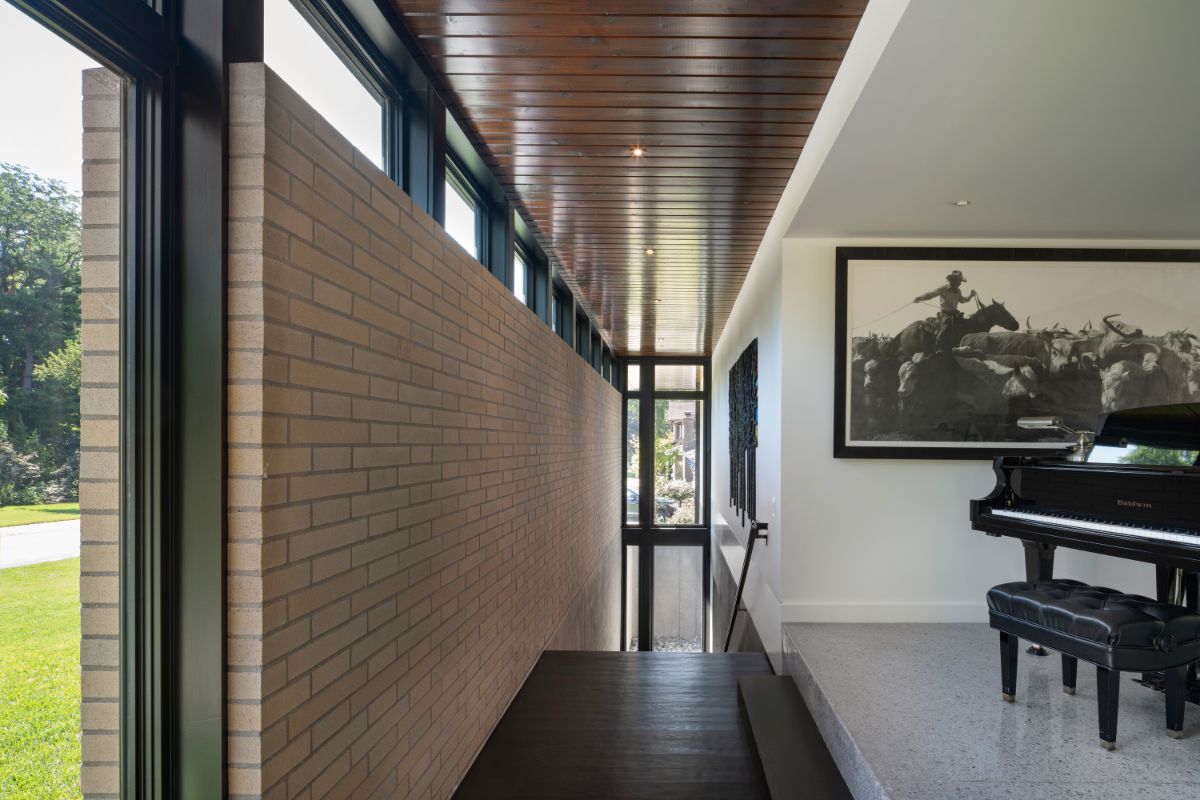 The top level living with the stair that serves as a transition between the interior and outside, as well as the first and second level living.