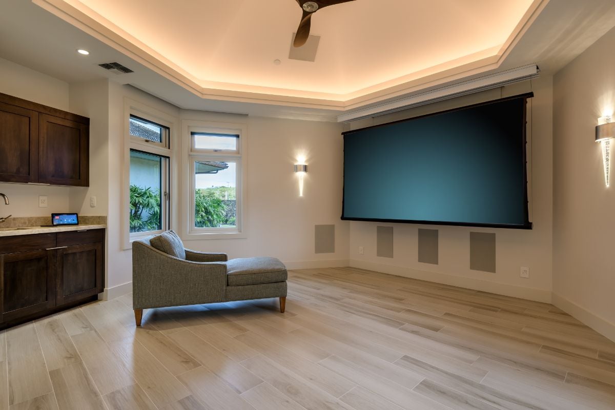 The media room perfectly designed for entertaining is equipped with smart electronics.