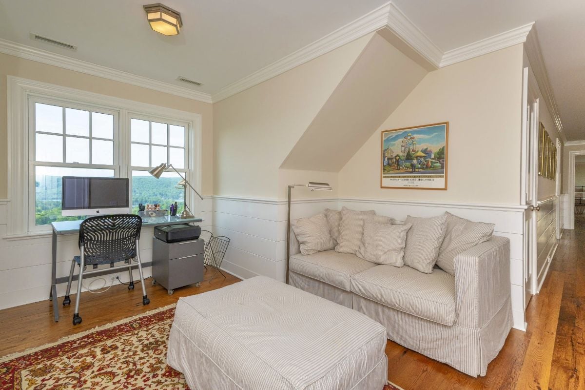 In the lounge, a comfortable sofa and plush carpet combined to create an inviting space that begged to be lounged in.
