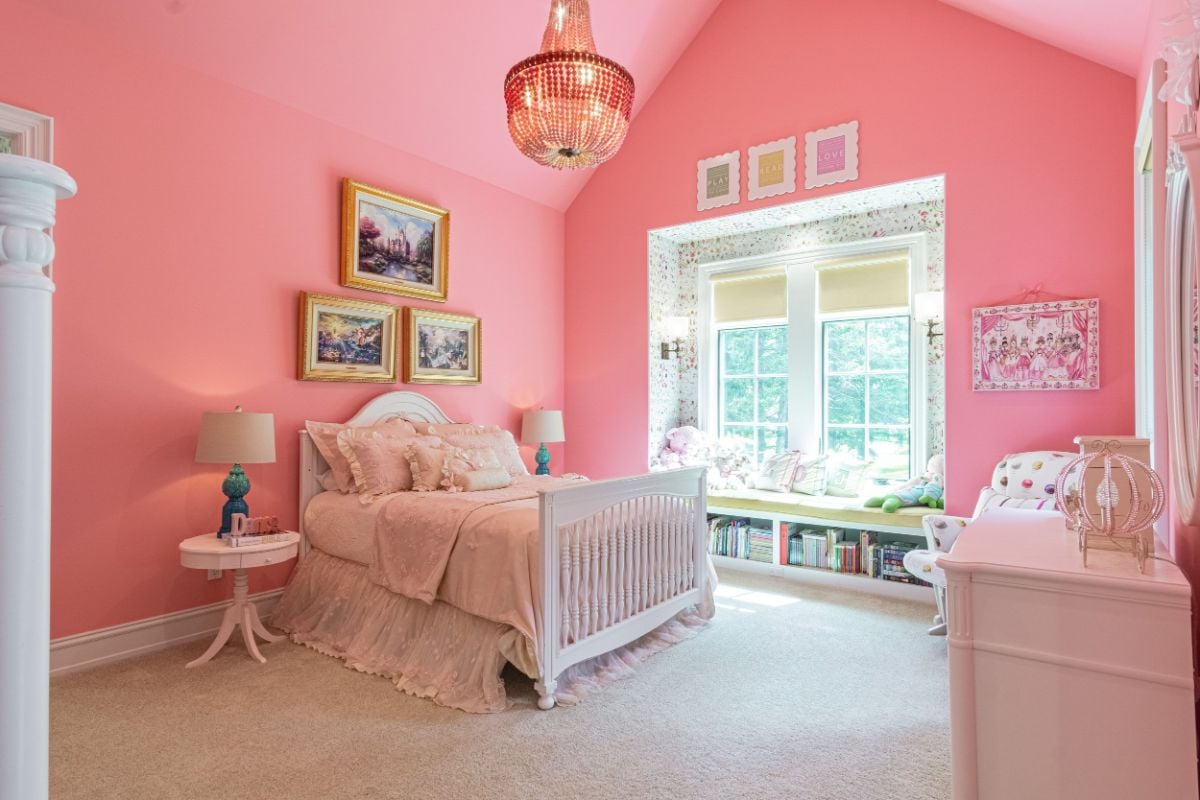 The kid's room features a double-size bed, a wall-to-wall carpet, and a window seat.