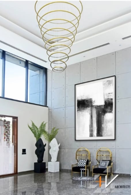 A crown ring pendant light is featured in a spacious living area.