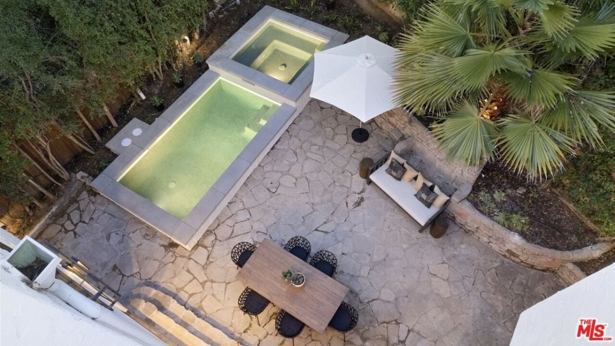 The outdoors features a heated swimming pool and spa perfect for relaxing.