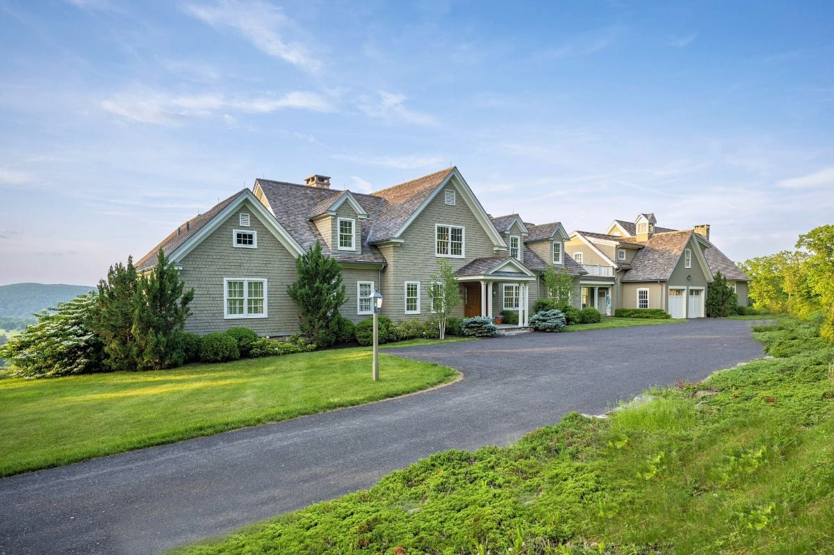 Perched high atop Gunn Hill in New Preston, this extraordinary 22-acre estate has panoramic views of Lake Waramaug and the Hills of Kent and Warren.