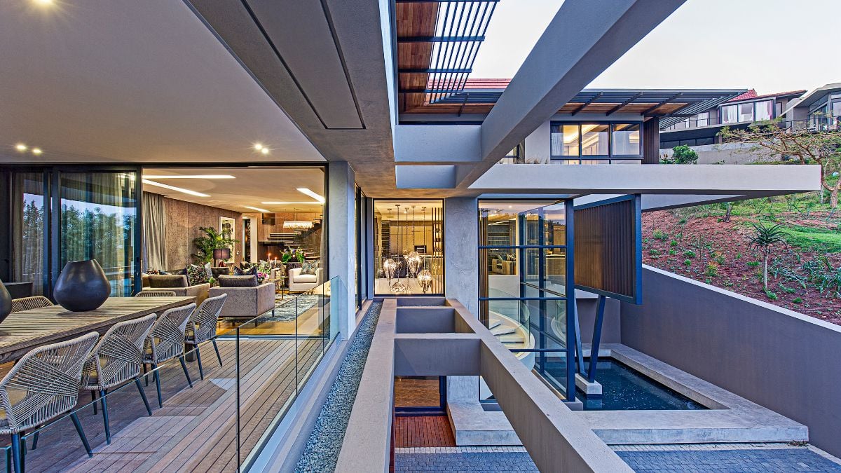The outdoor entertainment area is a seamless extension of the open-concept living area and is perched perilously beneath the master bedroom's seven-meter cantilever.