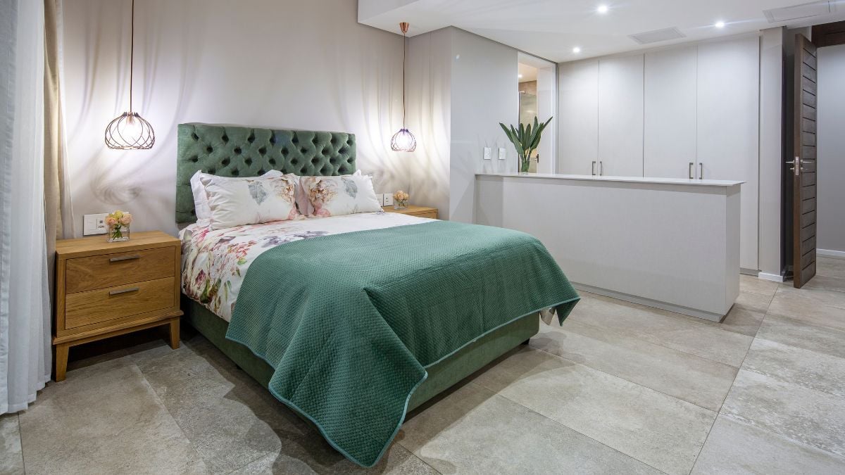 This bedroom features a unique mattress with a matcha hue that is distinct yet still lovely.