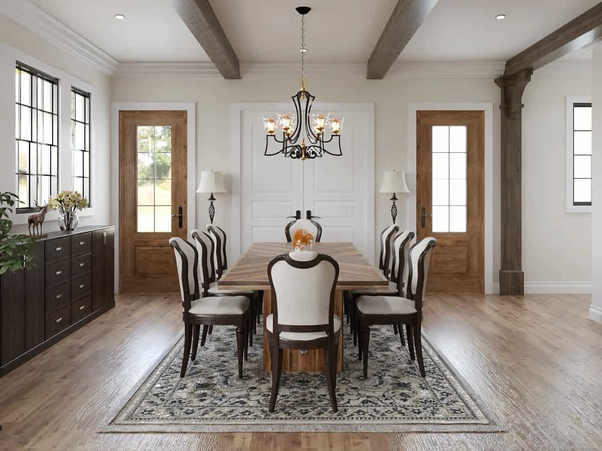 The dining room offers a buffet table and a dark wood dining set sitting on a vintage area rug.