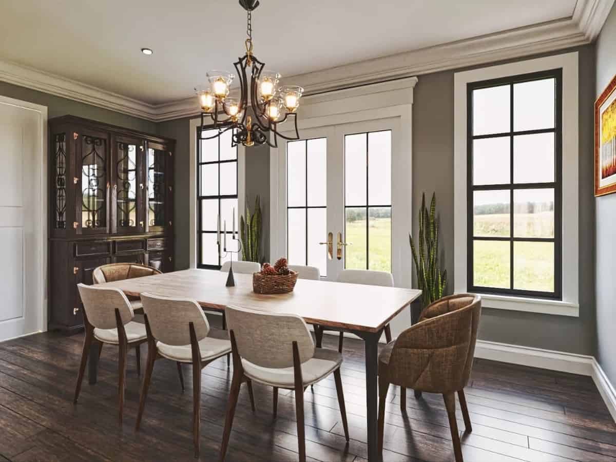 Breakfast area with a china cabinet, an 8-seater dining set, and a French door that opens to the back patio.