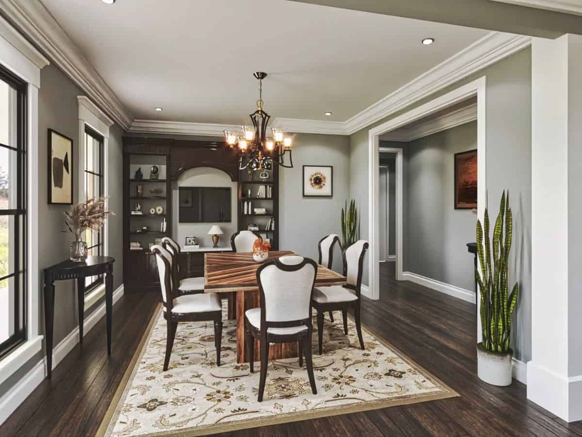 The formal dining room features a built-in cabinet and a wooden dining set sitting on a floral area rug.