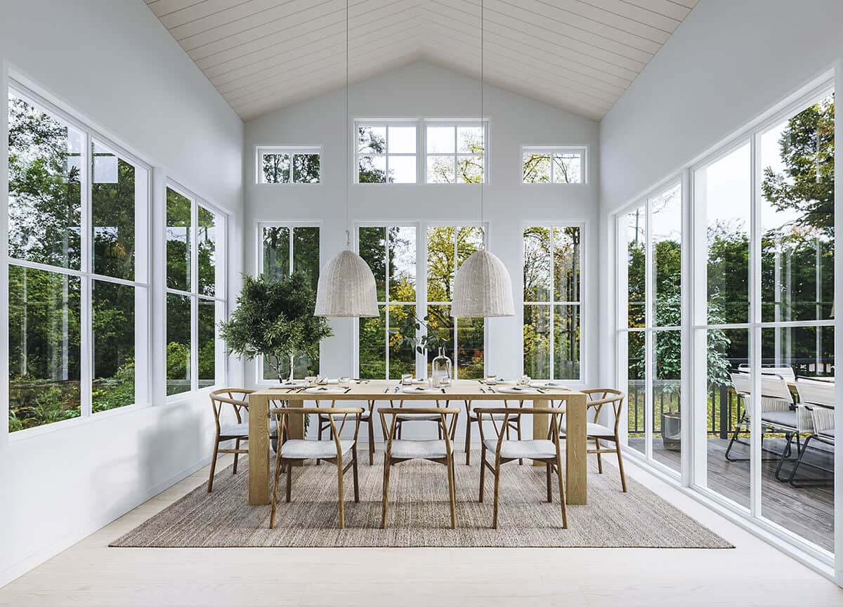 A cathedral ceiling crowns the dining room and sliding glass doors extend it onto a covered deck.
